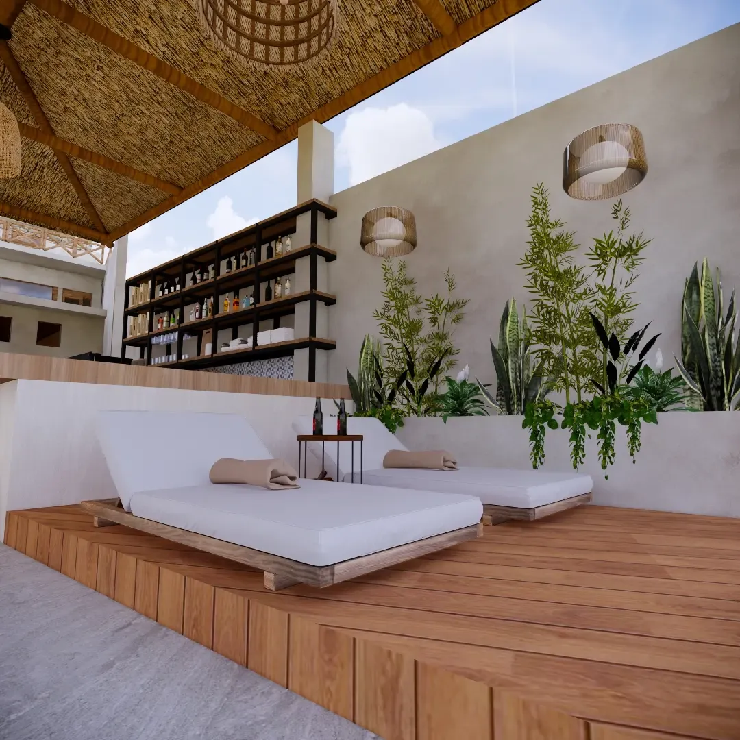 Camastros junto al bar, bajo sombra natural y entorno relajante